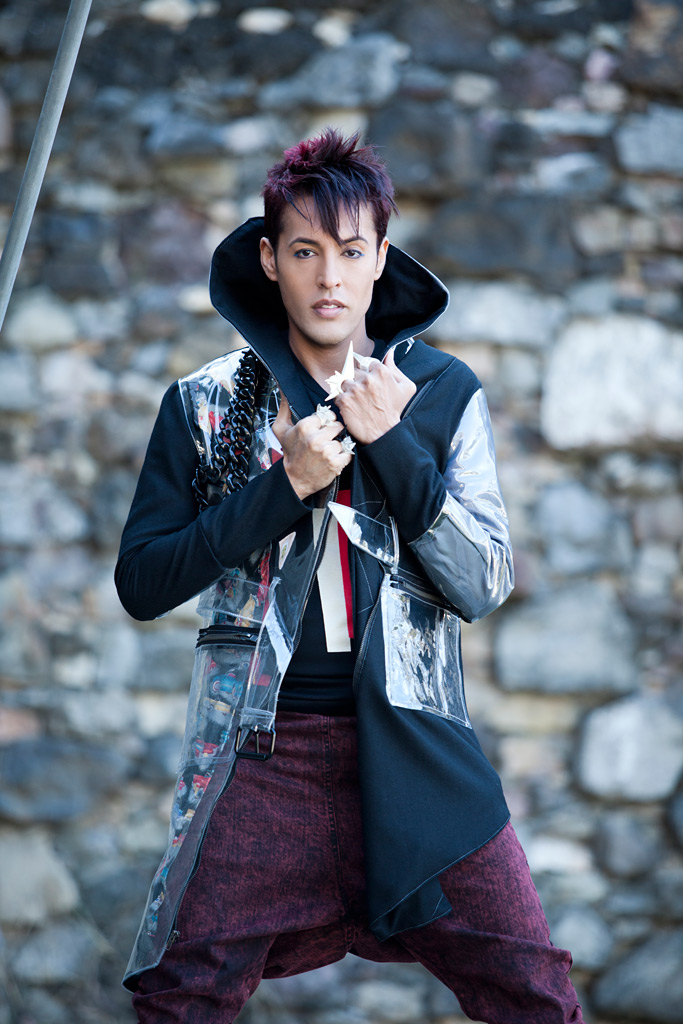 Dario in pop post-punk futuristic plastic jacket and purple highlights